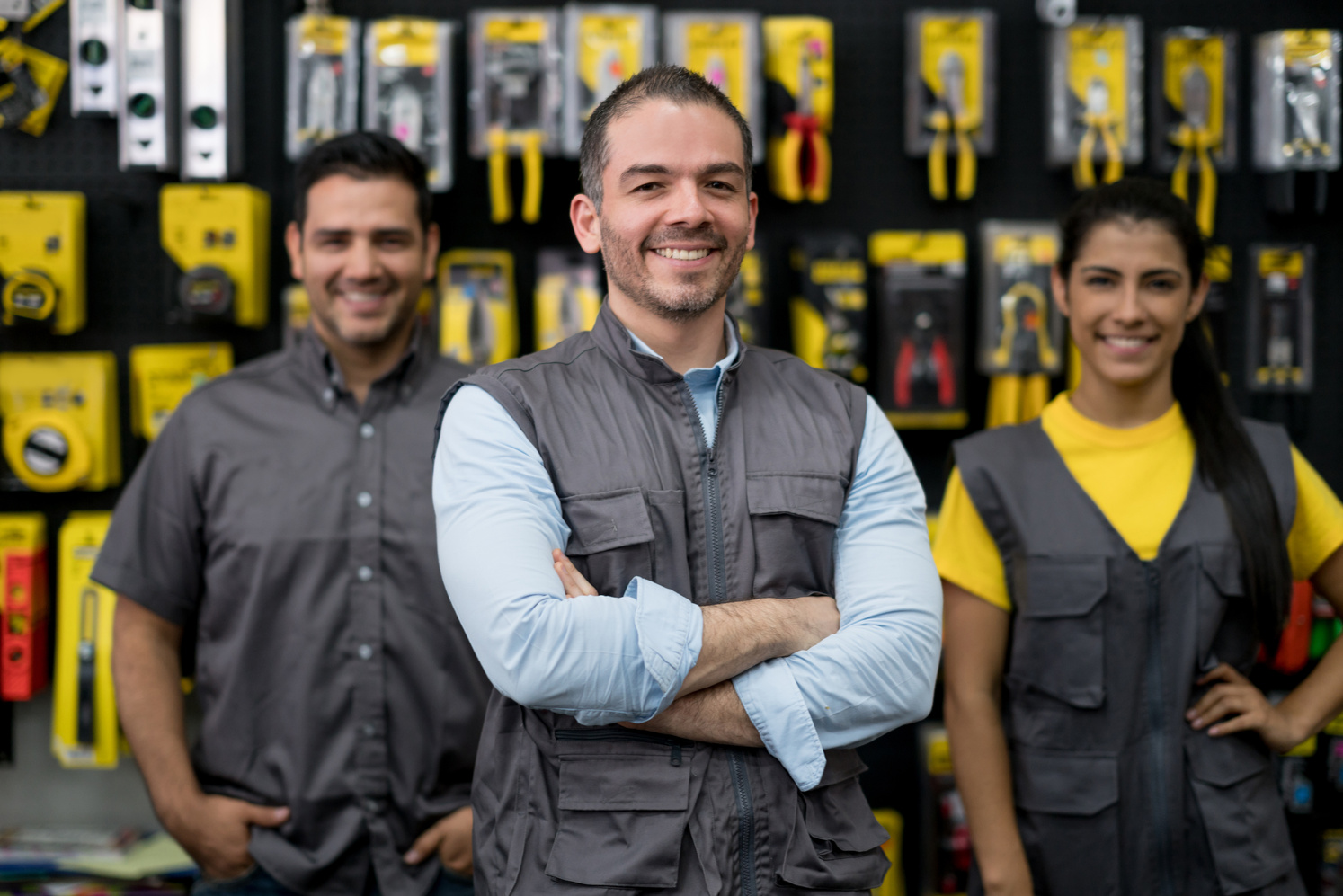 Staff working at a hardware store selling tools